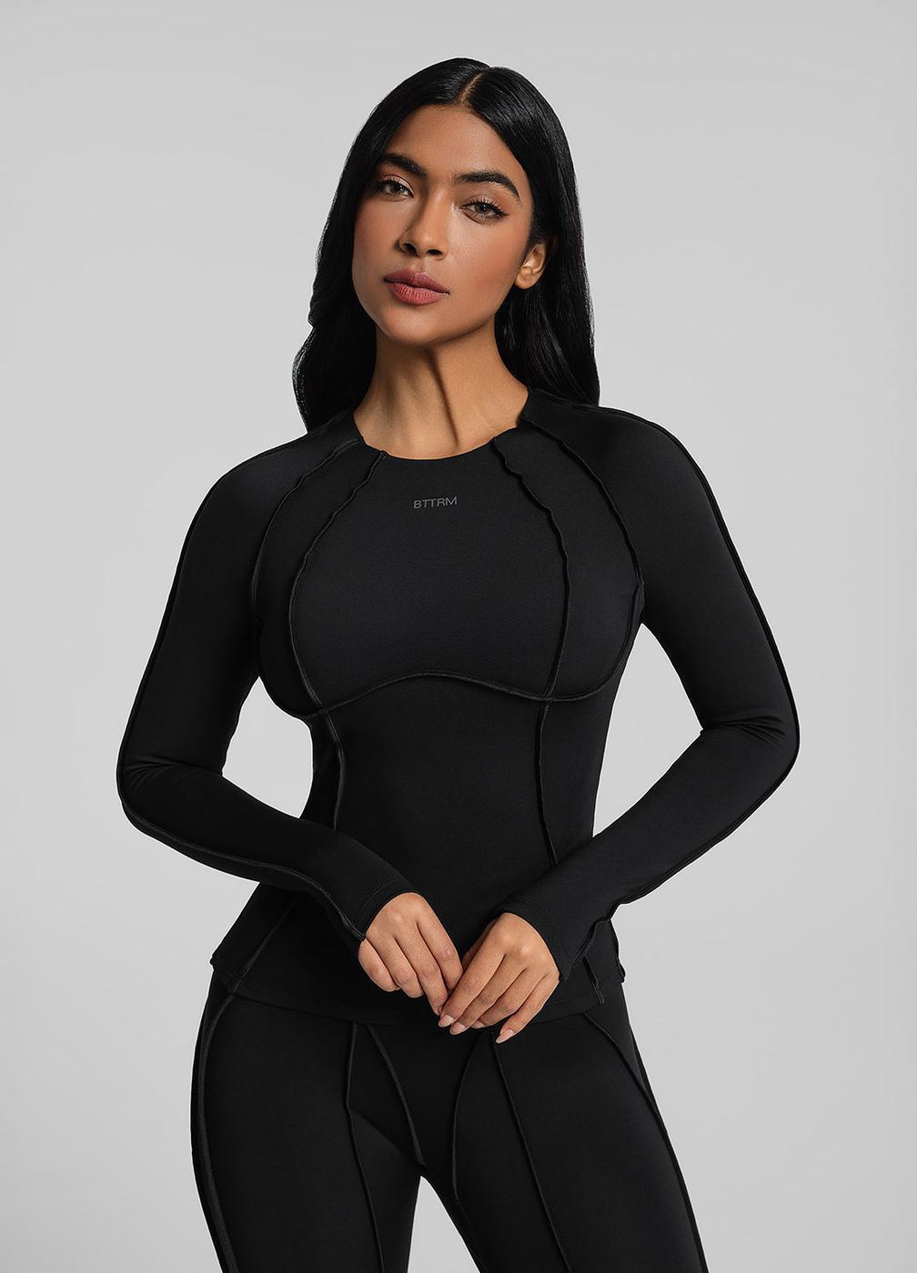 Contour Stitch Long Sleeve Top in Black, front view